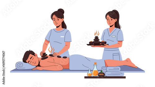Two professional masseuses perform a relaxing hot stone massage on a male client in a serene spa setting with essential oils and towels
