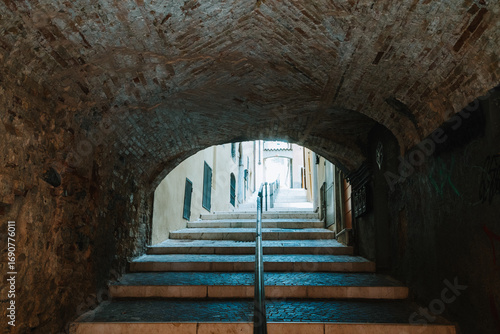 Photography A tunnel beneath a bridge in an Italian town on Lake Garda
