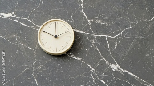 Wallpaper Mural A white clock with black hands and numbers on a marble countertop. Torontodigital.ca