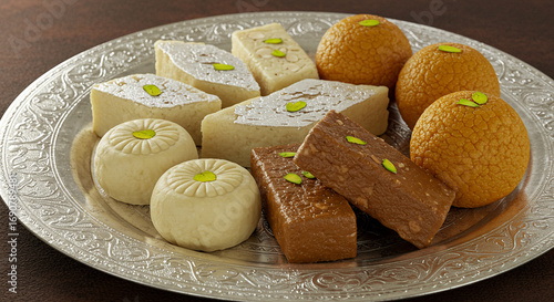 Exquisite Indian Sweets: Assortment on Silver Platter, Close-Up, Delicious Treats.