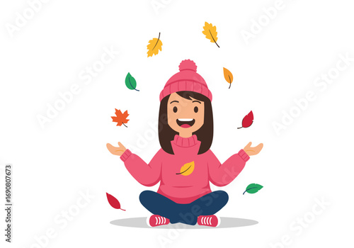 A happy child wearing a pink hat and sweater plays with colorful falling autumn leaves