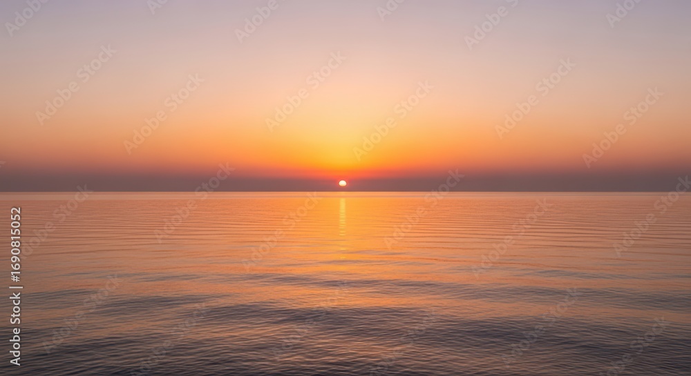 Naklejka premium Beautiful orange sunset sky over a calm sea horizon with sun setting. Golden hour and seascape concept.