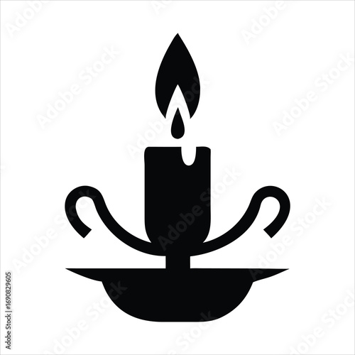 Black silhouette of a lit candle in a candlestick holder