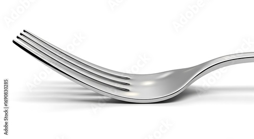 Close-up of a shiny silver fork on white background.