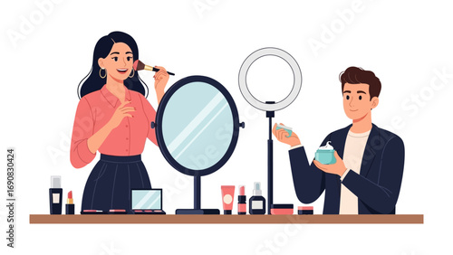 Two diverse young adults applying makeup and skincare products in front of a ring light and mirror for online content creation