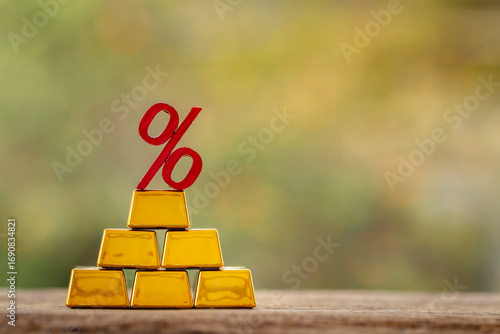 Stack gold bar with high as financial value for invest put on the old wood on the morning sunlight in public park, Targeting of business to winner and success concept.