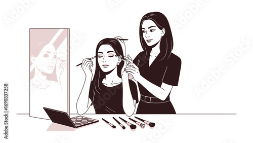 Professional makeup artist applying eyeshadow to a young woman in front of a mirror with makeup brushes and palette on a table
