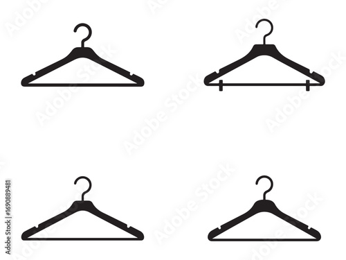 Four black plastic coat hangers displayed for a fashion or storage concept.