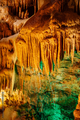 Stunning Stalagmites and Stalactites in an Illuminated Underground Cave Formation