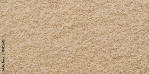 Close-up detail of a textured brown woolen carpet with a rough surface design