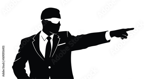 Businessperson in silhouette pointing with determination towards a goal