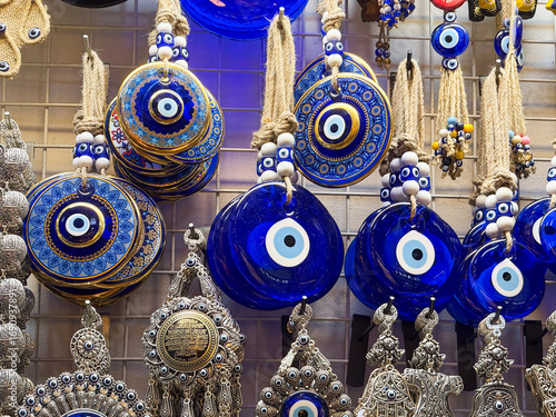 Traditional evil eye amulets displayed in a shop. Belief, culture, and protection through decorative ornaments.