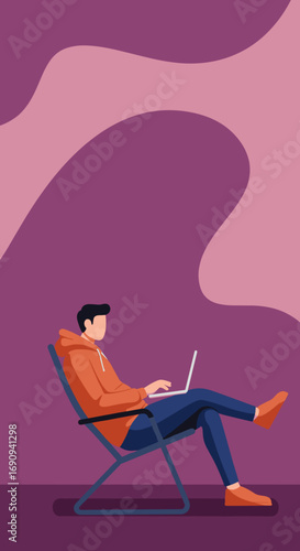 Young man in a hoodie and jeans relaxes in a chair, working or studying on his laptop. Represents remote work, casual computing, and modern lifestyle.