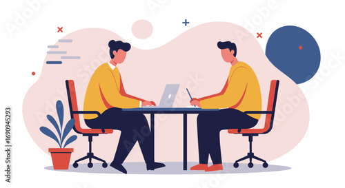 Two men collaborate at a modern office desk, one typing on a laptop, the other writing. Illustrates teamwork, business meetings, and professional partnership.
