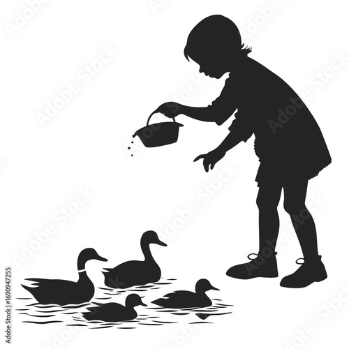 Child feeding ducks