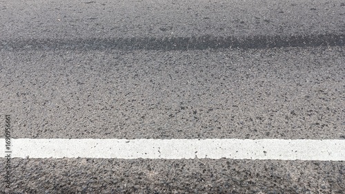 Asphalt road with white dividing line