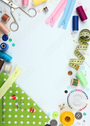 different sewing accessories on the table close-up. Vertical photo format