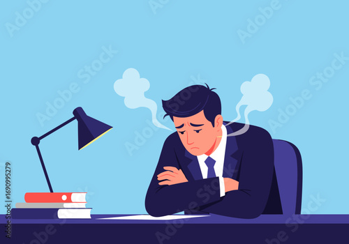 Frustrated businessman feeling overwhelmed and stressed at his desk with steam rising from his head