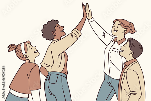 Diverse group of four young people celebrating success with a high five gesture expressing teamwork and achievement