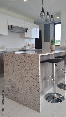 modern white kitchen with a cooking island