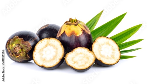 Fresh toddy palm fruits, sliced, and leaves