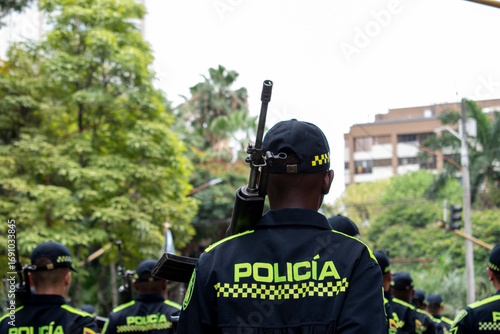 Armed police with long range weapons, Law enforcement officers carrying rifles, Colombian police with heavy firearms. High quality photo