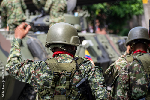Colombian army preparing for battle with armored vehicles and tanks, Soldiers getting ready for combat operations, Armed forces in military readiness with heavy equipment. High quality photo