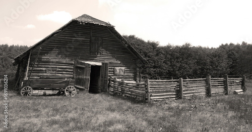 Wallpaper Mural Old wooden barn surrounded by greenery and a rustic fence on a sunny day in the countryside Torontodigital.ca