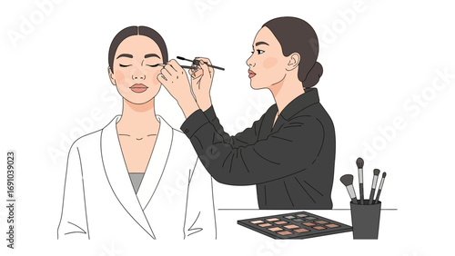 Professional makeup artist applying eye shadow to a client with closed eyes using a brush from an eyeshadow palette in a beauty salon setting