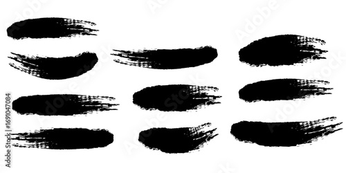 Collection of eleven black brush strokes with textured edges arranged on a white background in a pattern