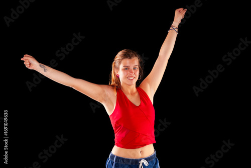 Young and beautiful woman at studio with black backgound
