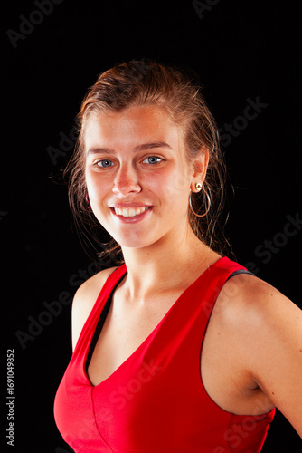Young and beautiful woman at studio with black backgound
