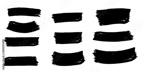 Collection of nine black brush stroke shapes with rough edges on a white background in a simple arrangement