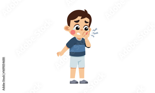 A young boy clutches his cheek in pain, indicating a toothache or discomfort.