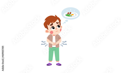 A young boy clutches his stomach with a worried expression, thinking about food.