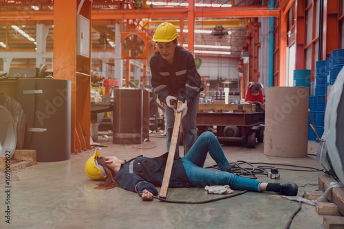 A female employee is helping her friend who was electrocuted in a metal cheese factory.