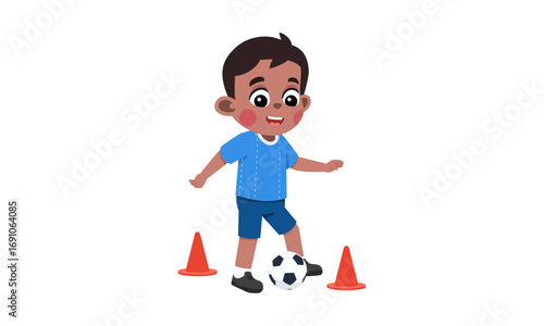 A young boy in a blue shirt and shorts dribbles a soccer ball between orange cones.