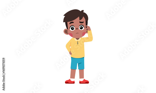 A young boy with a thoughtful expression, scratching his head, wearing a yellow shirt and blue shorts.