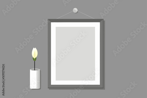 a simple silver frame  empty  on a light grey wall