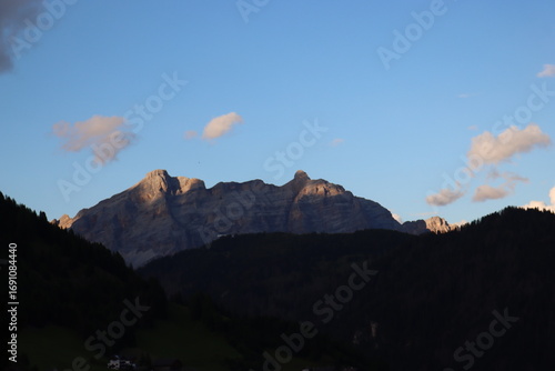 Trentino, Italy - July 29, 2025: Stunning Alpine scenery of breathtaking Dolomites rocks mountains in Italian Alps. Marmolada glacier seen in the distance from the slopes of the Porta Vescovo Dolomite