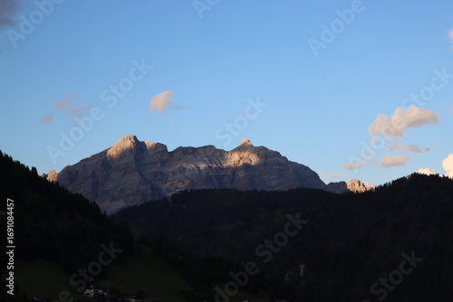 Trentino, Italy - July 29, 2025: Stunning Alpine scenery of breathtaking Dolomites rocks mountains in Italian Alps. Marmolada glacier seen in the distance from the slopes of the Porta Vescovo Dolomite