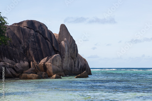 Large granite rocks in the blue Indian Ocean. La Digue, the Seychelles
