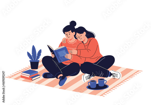 Two friends reading a book together enjoying a cozy afternoon pastime