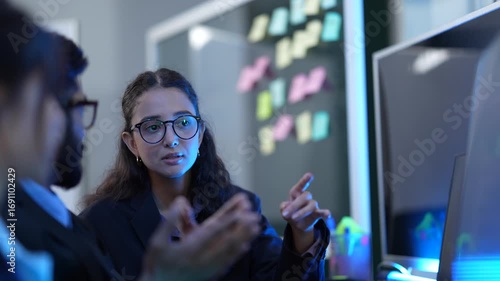 An AI development team conducts a sprint planning session for a new machine learning model. They use a kanban board to map out the data science workflow and review the algorithm's code.