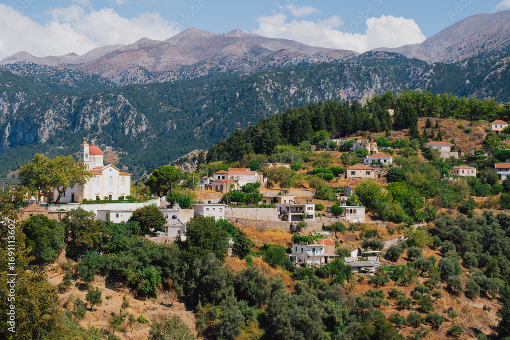 Naklejka premium Church and chapel of Agios Mamas in Lakkoi village in Crete mountains on sunny day