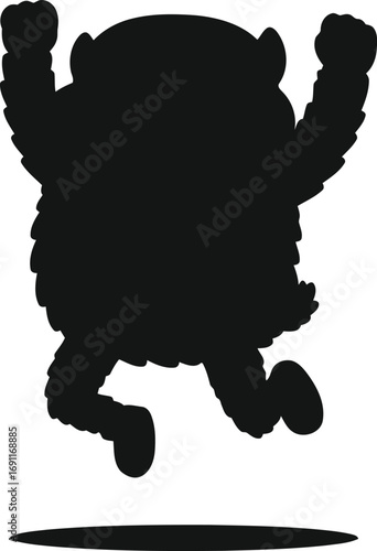 Silhouette of a happy monster jumping with arms raised high.