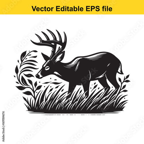 Silhouette of a majestic deer with large antlers standing in grass