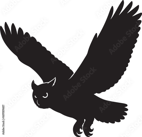 Black owl in flight with wings spread wide bird flying