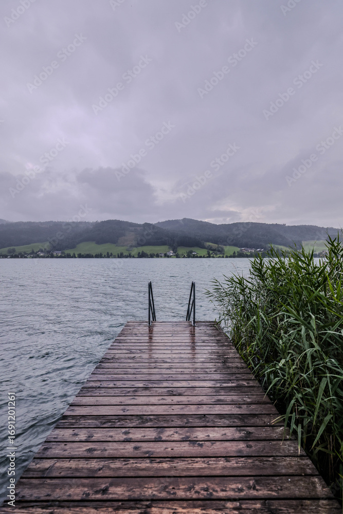 Naklejka premium Rainy day in Irrsee. Austria. Irrsee a lake in the Salzkammergut, Austria near the town of Zell am Moos.