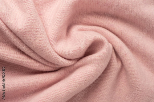 Soft pink cashmere sweater texture background.